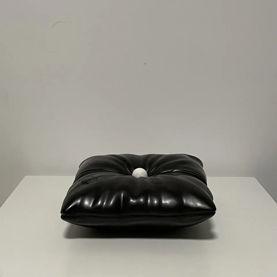 The cushion from the front, the ball sunk into the dimple.