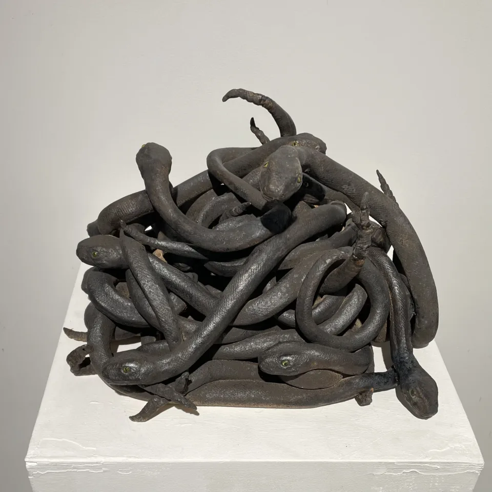 From slightly above, the knot of bodies.