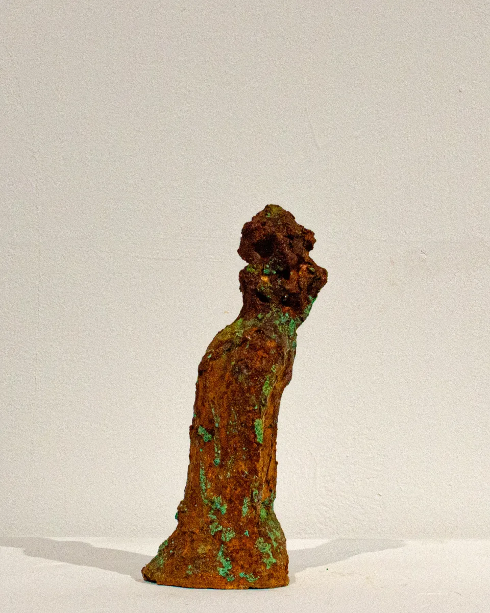 In profile, the head tilted back.