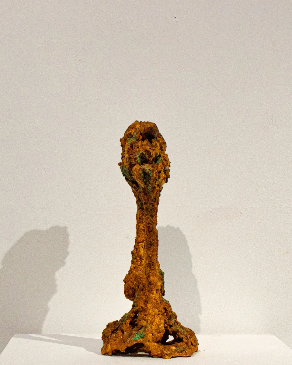 The stem rising to an open ring, from another side.