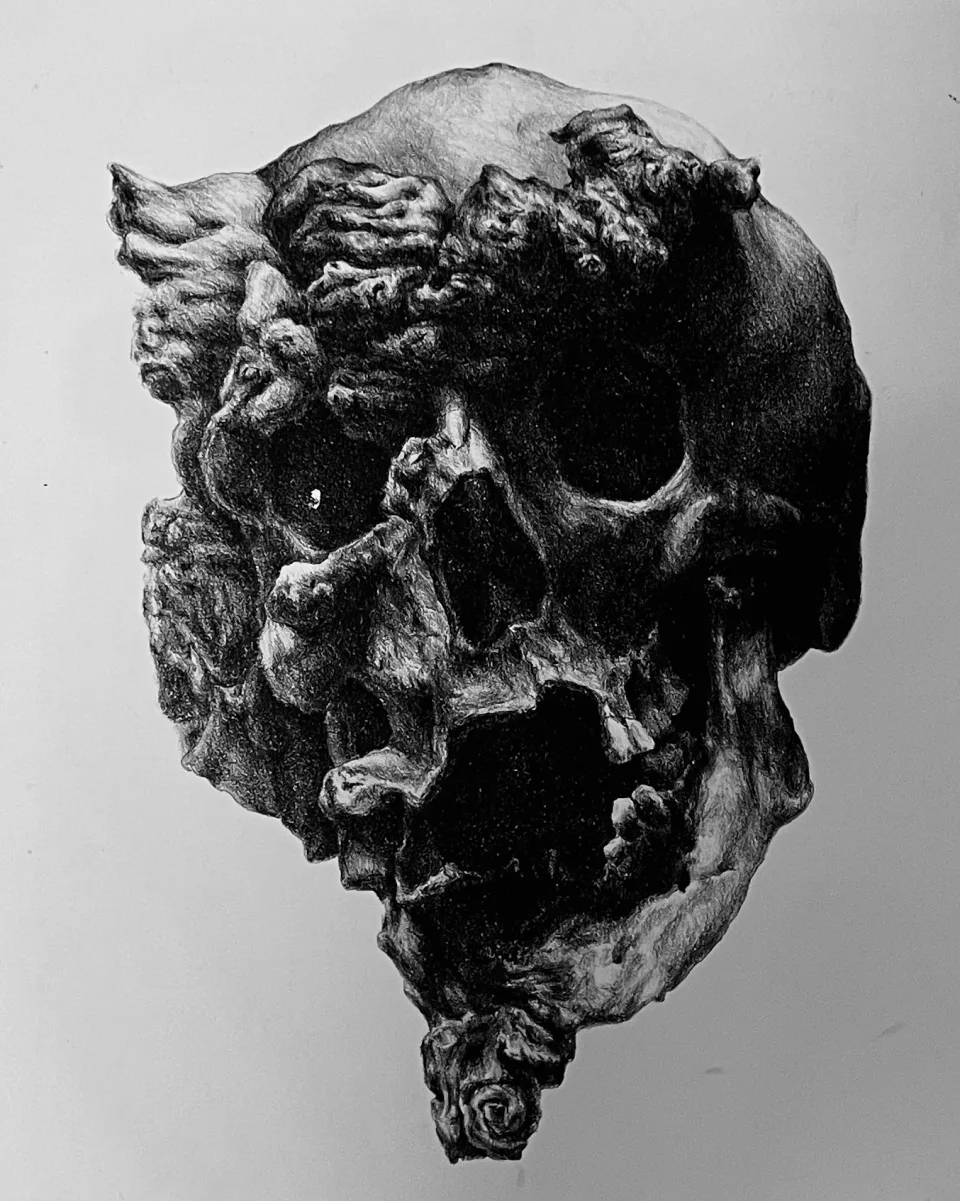 A darker impression, the teeth and eye sockets sharply defined.